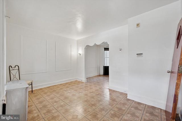 empty room with baseboards