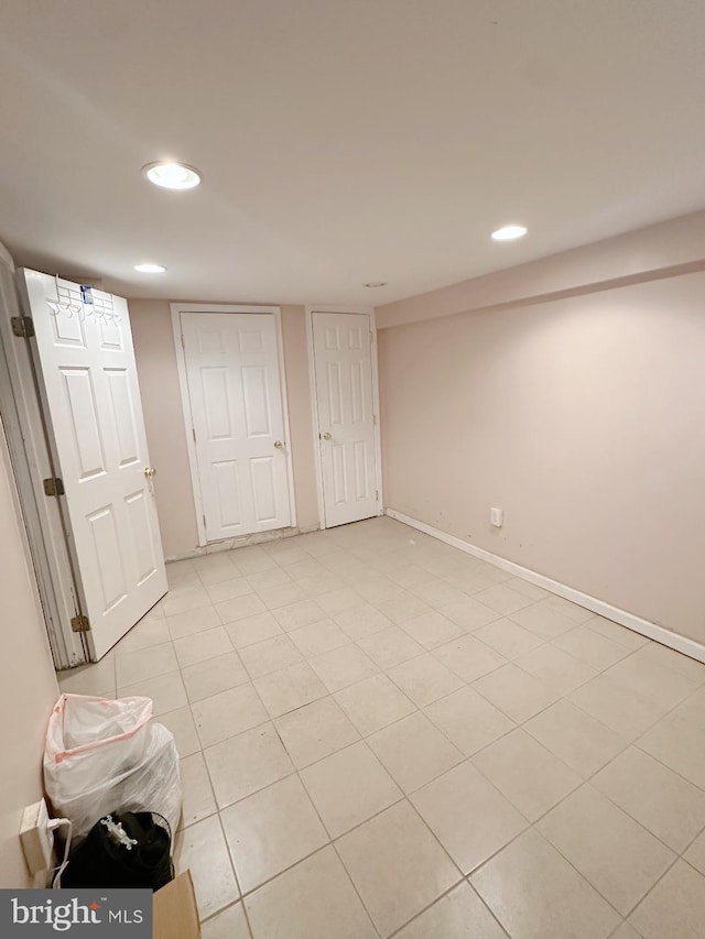 interior space featuring recessed lighting and baseboards