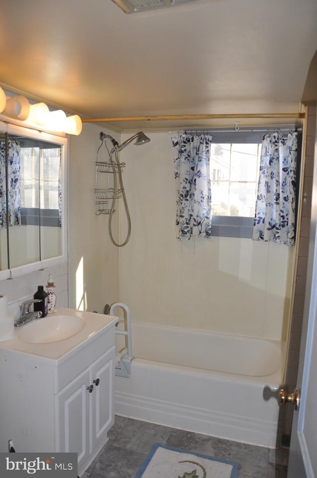 full bathroom with vanity, bathtub / shower combination, and a wealth of natural light