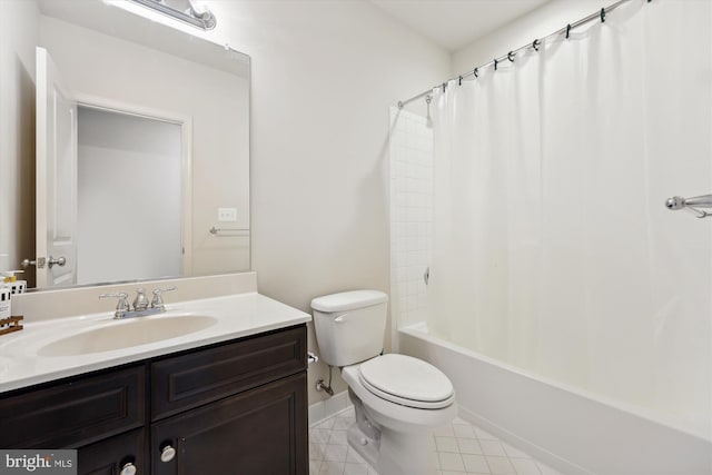 bathroom featuring toilet, tile patterned floors, shower / bath combo, and vanity