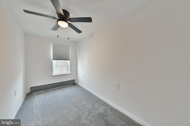 spare room with a baseboard heating unit, ceiling fan, light carpet, and baseboards