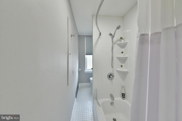 full bath featuring tub / shower combination, toilet, and tile patterned floors