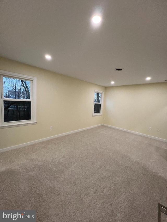 basement with carpet, baseboards, and recessed lighting