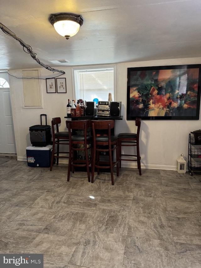 dining area featuring baseboards