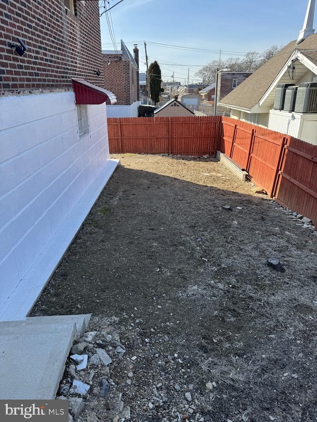 view of yard with a fenced backyard