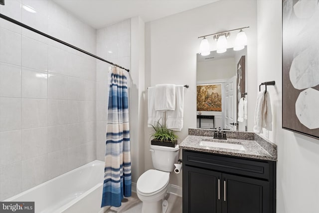 bathroom with vanity, shower / bath combo with shower curtain, toilet, and baseboards