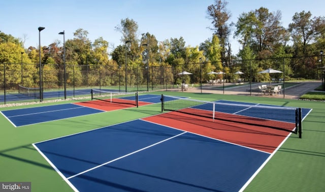 view of sport court with community basketball court and fence