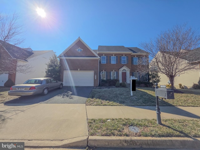 view of front of property featuring concrete driveway and brick siding