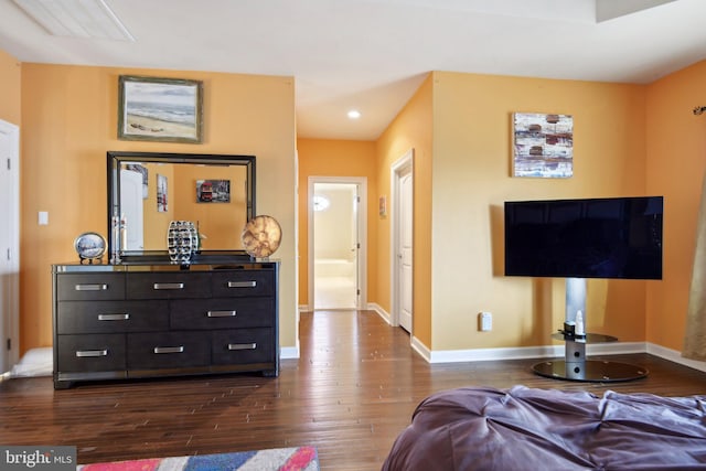 interior space featuring baseboards, dark wood finished floors, and recessed lighting