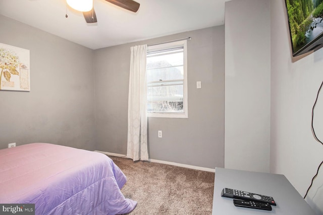 bedroom featuring carpet, baseboards, and ceiling fan