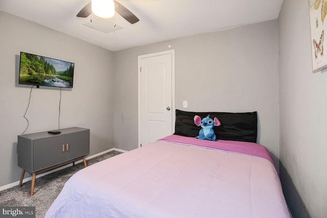 carpeted bedroom featuring a ceiling fan and baseboards