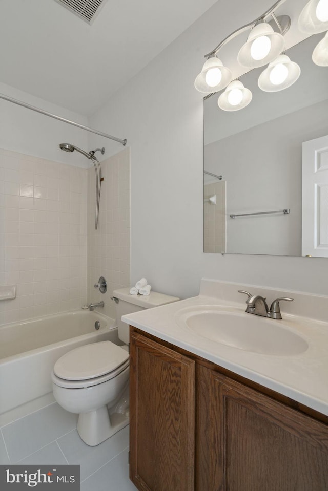 bathroom with tile patterned floors, visible vents, toilet, vanity, and shower / bathtub combination