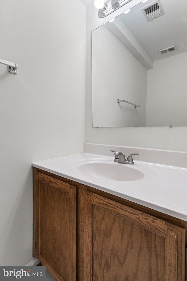 bathroom featuring visible vents and vanity