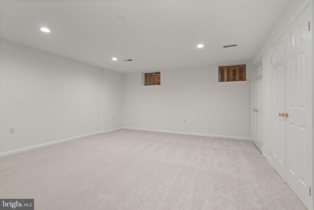 unfurnished room featuring recessed lighting, visible vents, baseboards, and light colored carpet