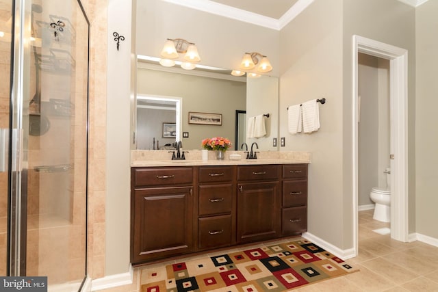 bathroom featuring a shower stall, ornamental molding, a sink, and tile patterned floors