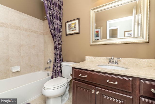 full bathroom featuring shower / bath combo, vanity, and toilet