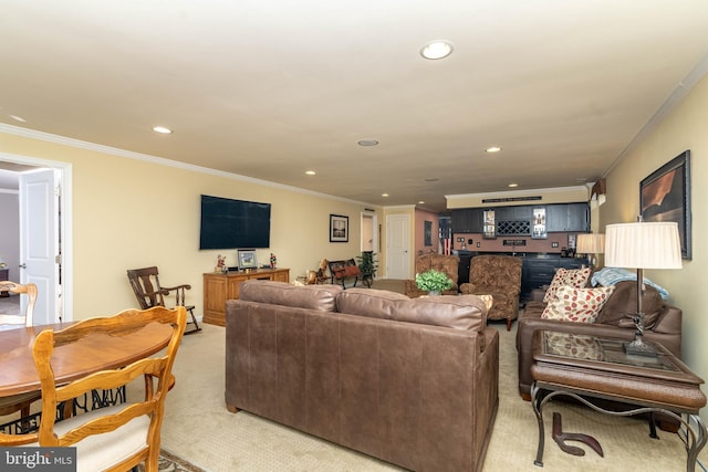 living room with light carpet, ornamental molding, and recessed lighting