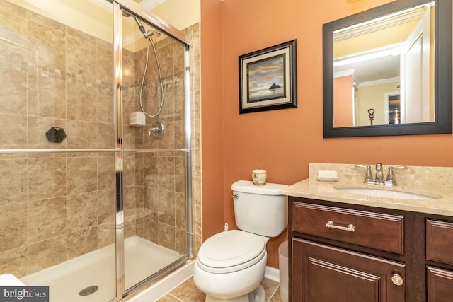 full bath featuring baseboards, toilet, tile patterned floors, vanity, and a shower stall