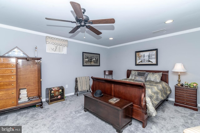 carpeted bedroom with ceiling fan, recessed lighting, visible vents, baseboards, and crown molding