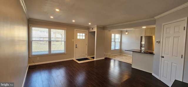 foyer featuring baseboards, dark wood-style flooring, recessed lighting, and crown molding