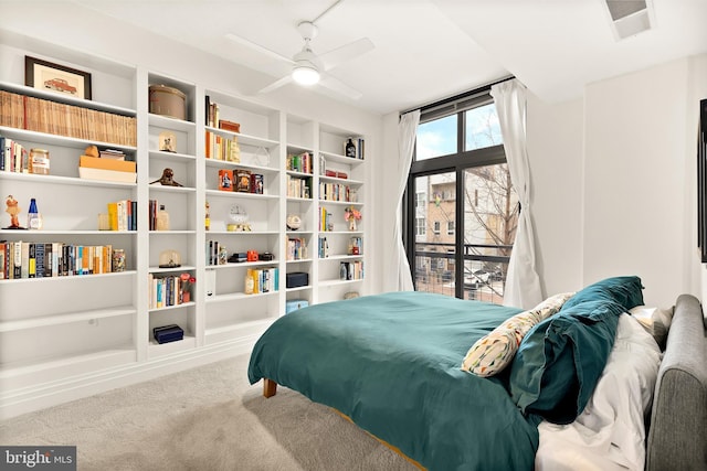 bedroom with visible vents, ceiling fan, and carpet flooring