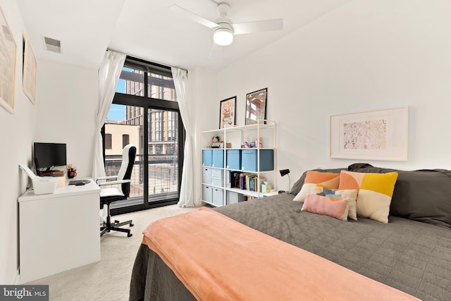 bedroom with access to outside, visible vents, and carpet floors