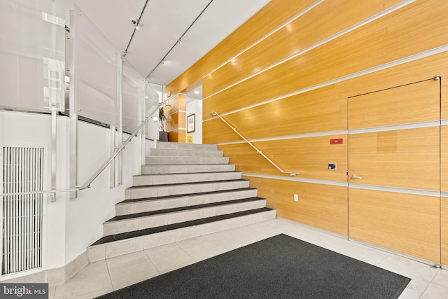 staircase with tile patterned flooring