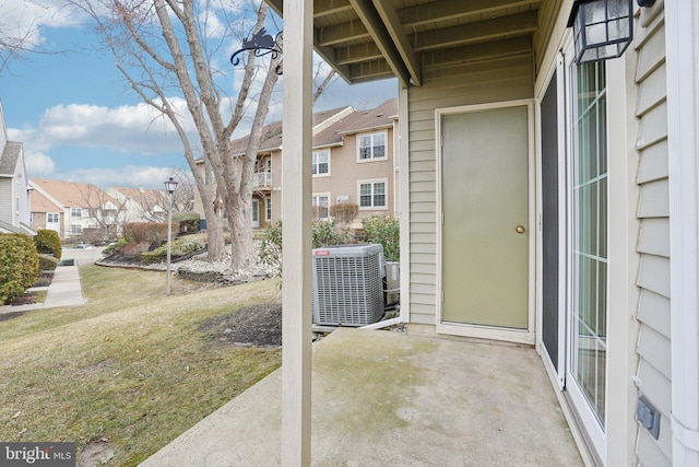 view of patio featuring a residential view and central AC