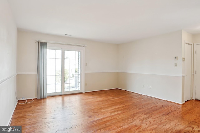 unfurnished room featuring light wood-style flooring