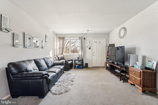 living room with baseboards and light colored carpet