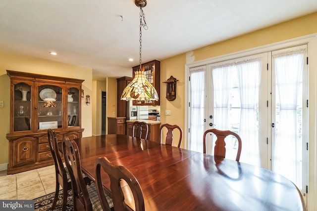 dining room featuring recessed lighting