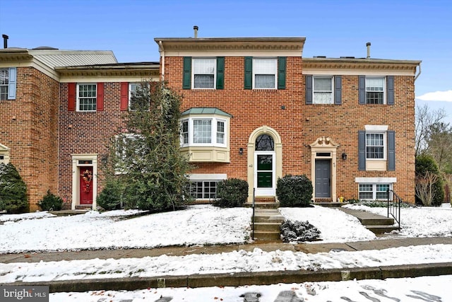 view of front of house featuring brick siding