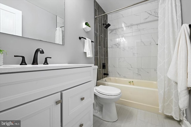 bathroom with vanity, toilet, and shower / bath combo with shower curtain