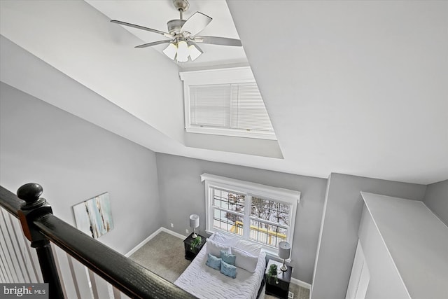 interior space featuring a ceiling fan and baseboards