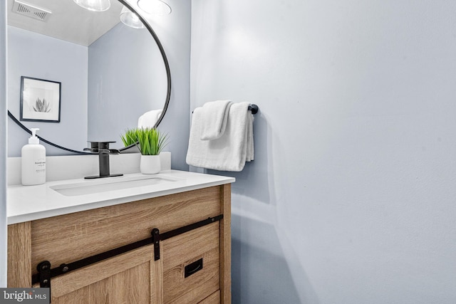 bathroom featuring visible vents and vanity