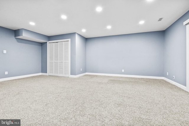 basement with carpet, baseboards, and recessed lighting