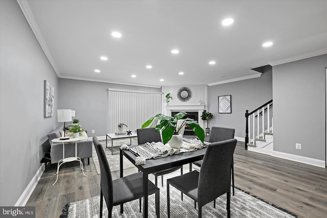 dining space featuring stairway, recessed lighting, wood finished floors, and baseboards