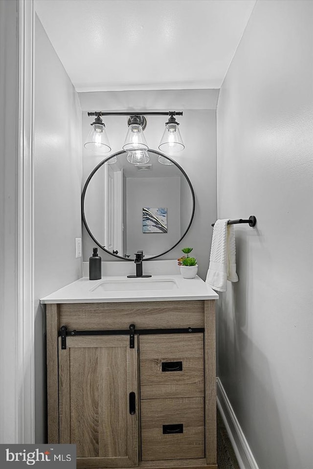 bathroom featuring vanity and baseboards