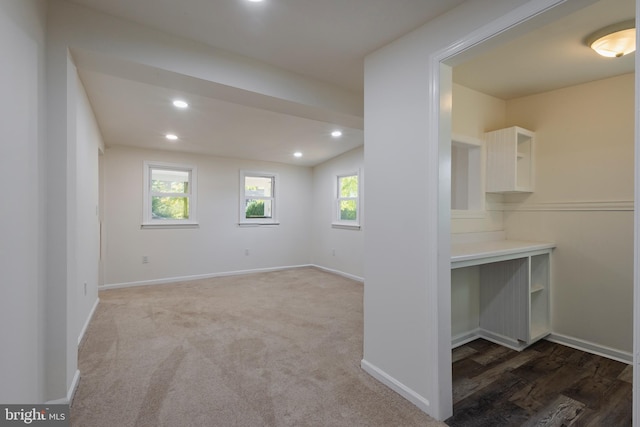 unfurnished room featuring baseboards, plenty of natural light, and recessed lighting