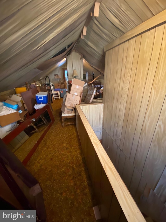 attic featuring an upstairs landing