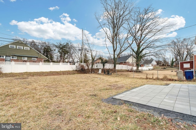 view of yard featuring a patio area and a fenced backyard