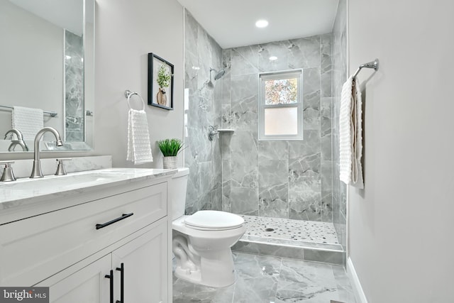 full bath with toilet, a stall shower, marble finish floor, and vanity