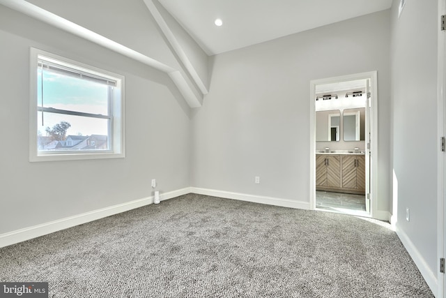 unfurnished bedroom with carpet floors, baseboards, ensuite bathroom, and recessed lighting