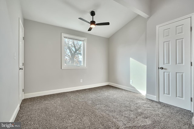 unfurnished room featuring carpet, ceiling fan, lofted ceiling, and baseboards