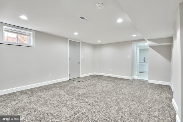 basement featuring recessed lighting, carpet flooring, visible vents, and baseboards