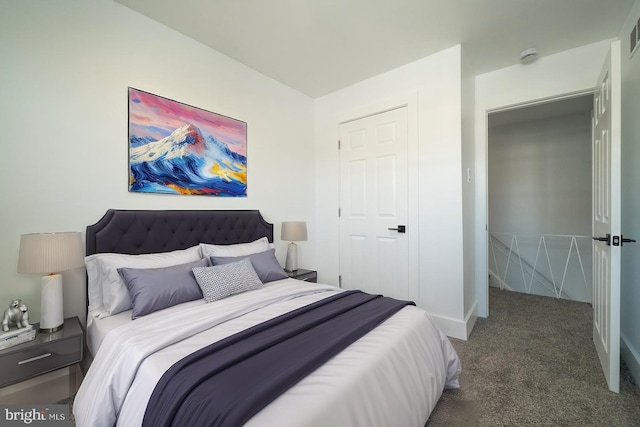 bedroom featuring dark carpet, visible vents, and baseboards