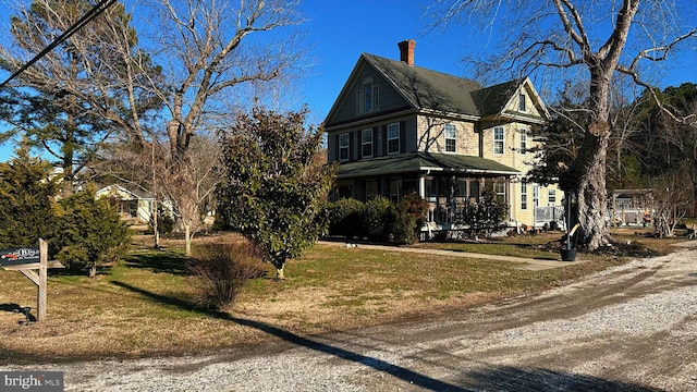 view of side of home featuring a sunroom