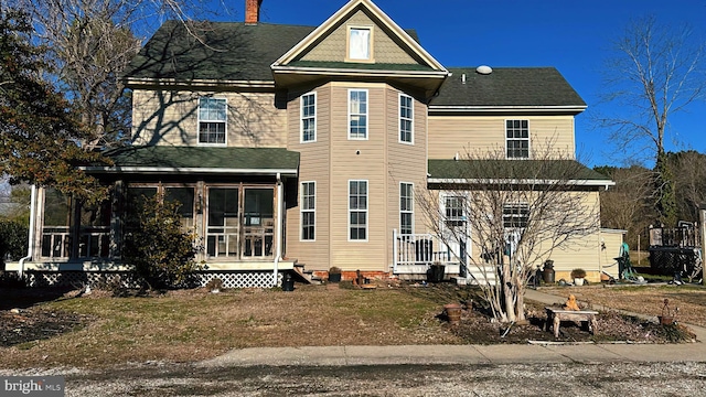 view of front of house with a sunroom