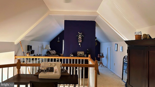 bedroom featuring light carpet and vaulted ceiling