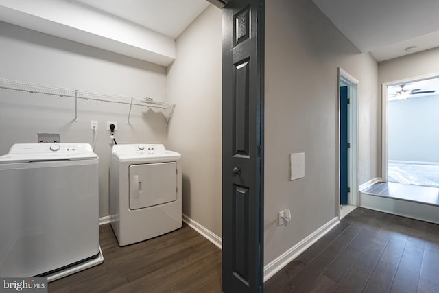 laundry room with baseboards, laundry area, dark wood-style flooring, and washer and dryer